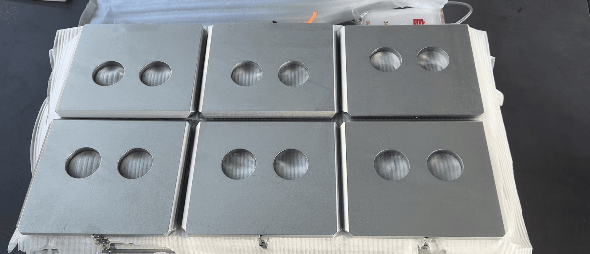 Batch of machined plates with cutouts