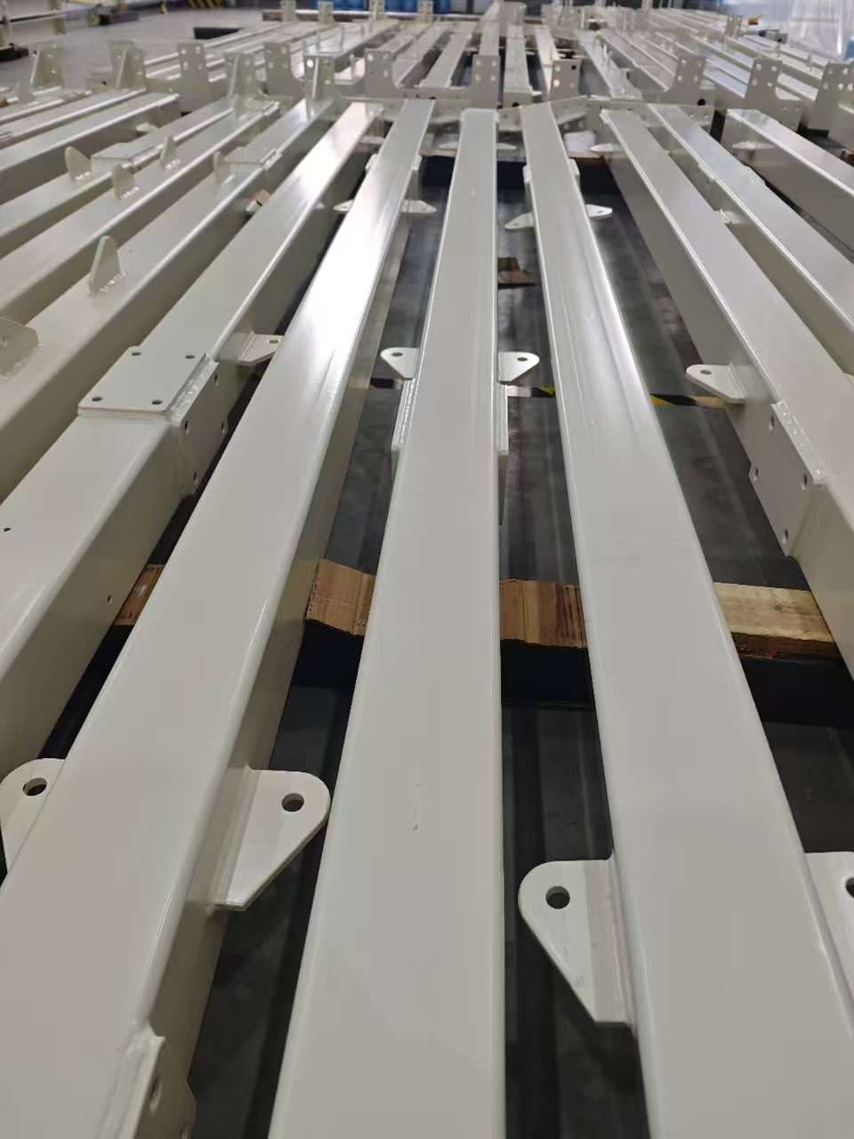 Painted steel beams with mounting brackets