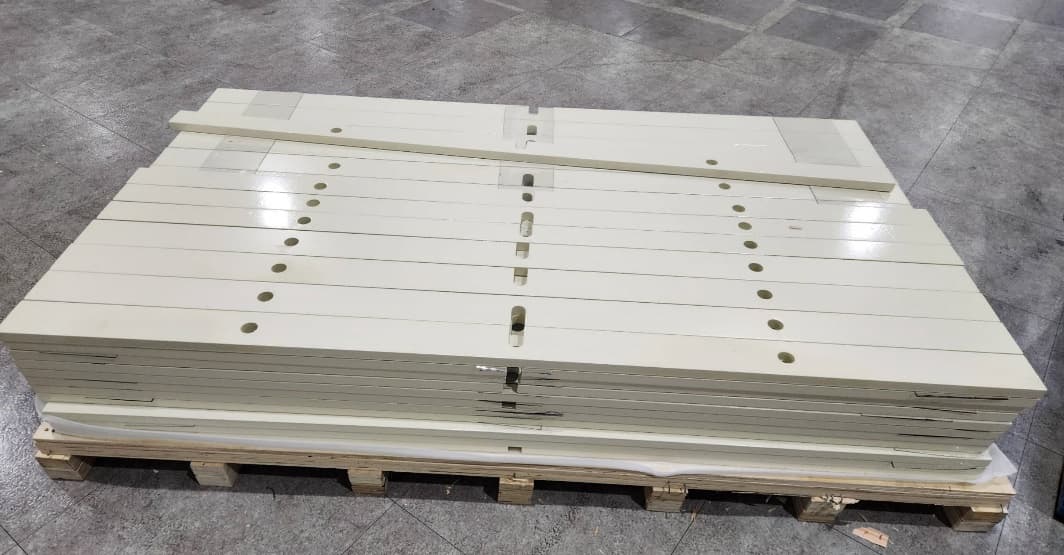 Stacked painted plates with precision holes